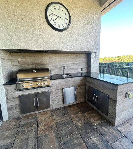 Timeless Covered Patio with Outdoor Kitchen, Built-In Hood, and Black Granite